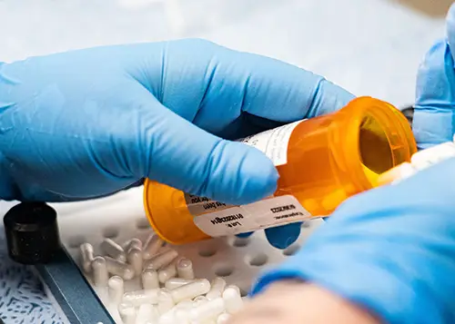 Filling a pill bottle